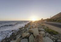 Dawn on a Coastal Road: Asphalt and Mountain Views