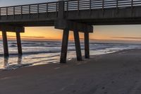 Dawn on the Coastal Shore with Bridge and Pier in Florida, USA