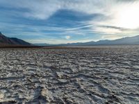 there is a very small body of water that looks like it could be moving in the desert