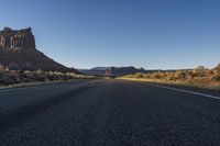Dawn on a Highland Road: Low Asphalt and Clear Sky