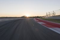 Dawn Highway: Automobile Racing at Sunrise