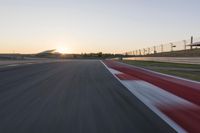 Dawn Highway: Automobile Racing at Sunrise