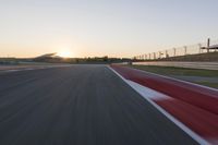 Dawn Highway: Automobile Racing at Sunrise