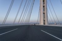 Dawn on the Highway: Morning Commute on a Bridge with Clear Skies