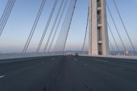 Dawn on the Highway: Morning Commute on a Bridge with Clear Skies