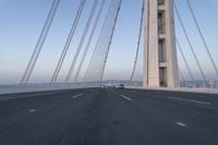 Dawn on the Highway: Morning Commute on a Bridge with Clear Skies