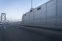 Dawn on the Highway: Road Lines and Clear Sky