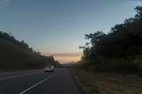 Dawn on the Highway: Scenic View of Rural Landscape