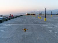an airport tarmac with three directional signs in the middle and the word parking written on the ground
