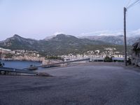 some hills and hills, with the road going to the boat yard, on the other side