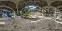 360 - view of a curved area with trees on either side of it and several levels of stairs and columns