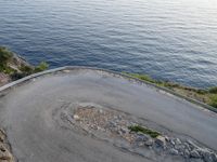 Dawn in Spain: Switchback Road with Ocean View