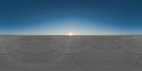 a white circle with lines made out of them on an arid plain with the sun in the background