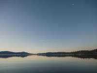 Dawn Landscape: Clear Sky and Reflection in the Lake
