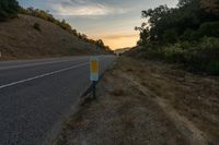 Dawn Landscape: Rural Hill with Trees and Clouds