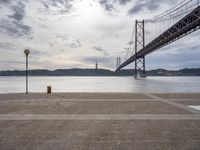 Dawn in Lisbon: Coast, Road, Bridge and Water