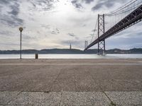 Dawn in Lisbon: Coast, Road, Bridge and Water