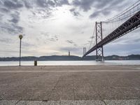 Dawn in Lisbon: Coast, Road, Bridge and Water