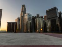 a big city on a nice day in the sunlight light up the sky with some tall buildings