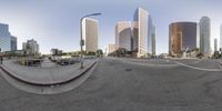a 360 - eye view of an empty street in the city with lots of buildings