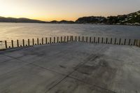 Sunshine over Dawn Ocean Pier with Clear Sky