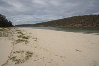 the sandy beach is empty, but there is nothing to see here in the water