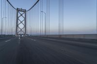 Dawn on the Bridge: Asphalt Highway Under Clear Sky