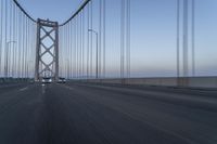 Dawn on the Bridge: Asphalt Highway Under Clear Sky