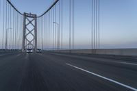 Dawn on the Bridge: Asphalt Highway Under Clear Sky