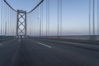 Dawn on the Bridge: Asphalt Highway Under Clear Sky