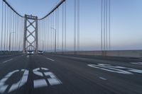 Dawn on the Bridge: Asphalt Highway Under Clear Sky