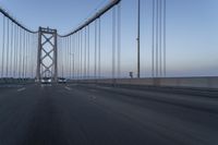 Dawn on the Bridge: Asphalt Highway Under Clear Sky