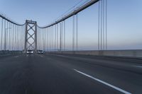 Dawn on the Bridge: Asphalt Highway Under Clear Sky