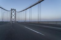 Dawn on the Bridge: Asphalt Highway Under Clear Sky