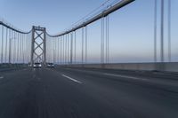 Dawn on the Bridge: Asphalt Highway Under Clear Sky