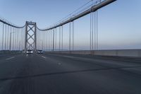 Dawn on the Bridge: Asphalt Highway Under Clear Sky