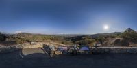 the view over a town with a lot of hills in front of it, is from a point - of - view lens