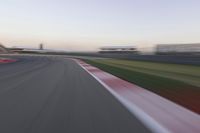 Dawn Over the Race Track: Clear Sky and Racing