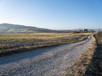 Dawn Over Tuscan Landscape: Clear Sky and Serene Beauty