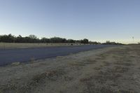 Dawn Over USA: A Serene View of a Rural Field and Tree