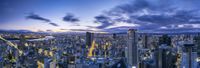 the cityscape of hong at twilight has many tall buildings, such as this one in a big city