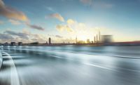 blurred city skyline with large city and freeways at sunset time, long exposure photograph