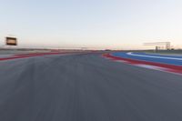 Dawn on the Race Track: Asphalt and Automobiles