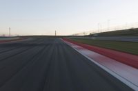 Dawn on the Race Track: Automobiles Against a Clear Sky