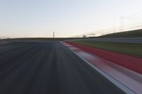 Dawn on the Race Track: Automobiles Against a Clear Sky