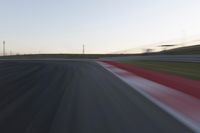 Dawn on the Race Track: Automobiles Against a Clear Sky