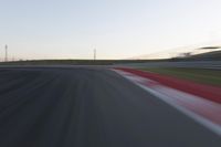 Dawn on the Race Track: Automobiles Against a Clear Sky