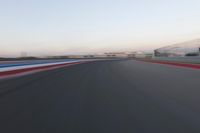 a race track with the front end blurredd out with blurry lines from a car