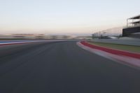 a race track with the front end blurredd out with blurry lines from a car