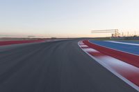 Dawn at the Race Track Stadium: A Clear Sky for Racing